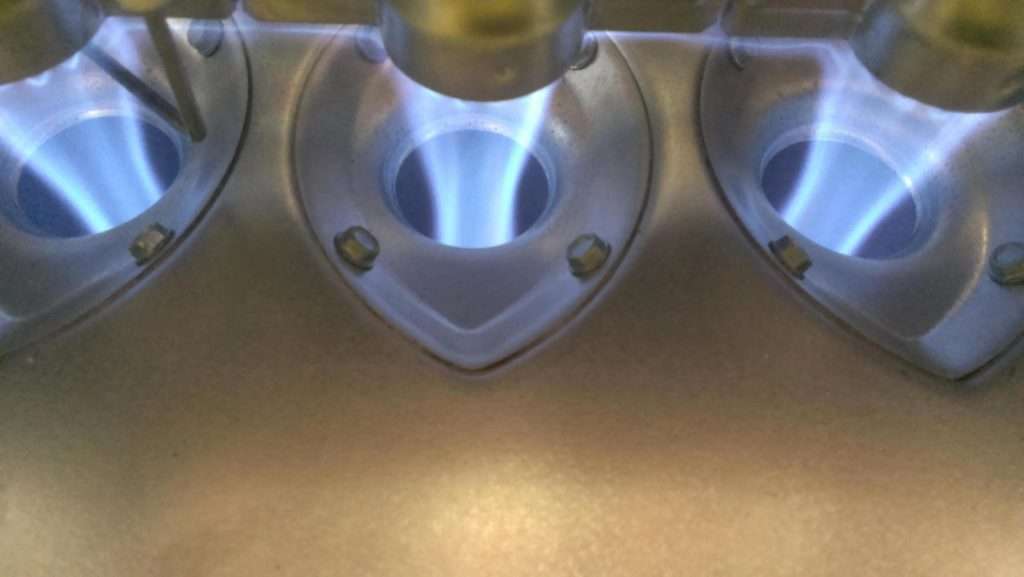 Blue flames from home furnace after a technician from Custom cleaned in Tulsa.